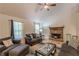 Inviting living room with a cozy stone fireplace, vaulted ceiling, and ample natural light at 5609 Twin Oak Dr, Douglasville, GA 30135