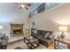 Bright living room with a stone fireplace, vaulted ceiling, and upper-level views, perfect for entertaining at 5609 Twin Oak Dr, Douglasville, GA 30135