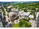 Stunning aerial view showcasing the building's location, lush surroundings, and vibrant cityscape in the distance at 1421 Peachtree Ne St # 401, Atlanta, GA 30309