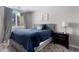 Comfortable bedroom with city views from window, a bed, and a nightstand at 1421 Peachtree Ne St # 401, Atlanta, GA 30309