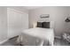 Comfortable bedroom featuring a bed, closet, and light gray flooring at 1421 Peachtree Ne St # 401, Atlanta, GA 30309