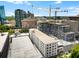 Urban landscape highlighting the city skyline with construction cranes and buildings at 1421 Peachtree Ne St # 401, Atlanta, GA 30309