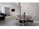 Charming dining room featuring a round table, four chairs, and views into the living area at 1421 Peachtree Ne St # 401, Atlanta, GA 30309