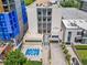 Exterior view of condo building, showcasing modern architecture and a pool at 1421 Peachtree Ne St # 401, Atlanta, GA 30309