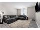 Comfortable living room showcasing a plush gray sectional sofa, soft rug, and stylish decor at 1421 Peachtree Ne St # 401, Atlanta, GA 30309