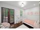 Bright bedroom with dark wood floors, ample natural light, and stylish, -friendly decor at 1734 8Th St, Brookhaven, GA 30341