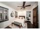 This is a bedroom with a ceiling fan, wood floors, a ceiling fan, and built-in shelving at 1734 8Th St, Brookhaven, GA 30341