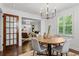 Open concept from dining to living room featuring wood floors, and lots of natural light at 1734 8Th St, Brookhaven, GA 30341