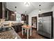 This is a kitchen with stainless steel appliances, granite counters, wooden cabinets, and natural light at 1734 8Th St, Brookhaven, GA 30341