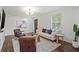 Inviting living room featuring hardwood floors, white walls, and neutral modern furniture at 1734 8Th St, Brookhaven, GA 30341