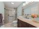 Bathroom featuring a glass shower, granite vanity, and neutral tiling at 1800 Clairmont #428 Lk # A428, Decatur, GA 30033