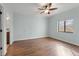 Light-filled bedroom with hardwood floors, ceiling fan and large window view at 1800 Clairmont #428 Lk # A428, Decatur, GA 30033