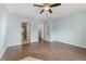 Spacious bedroom featuring hardwood floors, ceiling fan, and access to a bathroom and walk-in closet at 1800 Clairmont #428 Lk # A428, Decatur, GA 30033