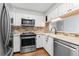 Modern kitchen with stainless steel appliances, stone backsplash and granite countertop at 1800 Clairmont #428 Lk # A428, Decatur, GA 30033