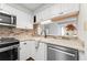 Updated kitchen featuring white cabinets, stainless steel appliances and stylish backsplash at 1800 Clairmont #428 Lk # A428, Decatur, GA 30033