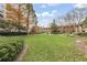 Well-maintained lawn and garden area, surrounded by landscaping and trees at 1800 Clairmont #428 Lk # A428, Decatur, GA 30033