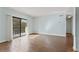 Open living area with balcony access, beautiful wood-look floors, and neutral walls at 1800 Clairmont #428 Lk # A428, Decatur, GA 30033
