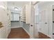 Spacious walk-in closet with custom shelving and storage, complemented by hardwood floors at 1800 Clairmont #428 Lk # A428, Decatur, GA 30033