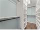 Spacious walk-in closet with custom shelving and ample storage space, and wood floor at 1800 Clairmont #428 Lk # A428, Decatur, GA 30033