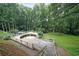 Backyard deck provides views of the wooded property at 3743 Wyntuck Nw Cir, Kennesaw, GA 30152