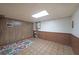 Basement offers wood paneled walls, carpet, and a bright ceiling light fixture at 3743 Wyntuck Nw Cir, Kennesaw, GA 30152