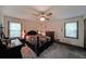 Bedroom featuring carpet, a ceiling fan, two windows, and traditional furniture at 3743 Wyntuck Nw Cir, Kennesaw, GA 30152