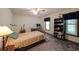 Cozy bedroom with carpet flooring, a bed, a desk, and a bookshelf at 3743 Wyntuck Nw Cir, Kennesaw, GA 30152