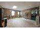 Spacious bonus room with wood paneling, carpet flooring, and exterior door at 3743 Wyntuck Nw Cir, Kennesaw, GA 30152
