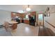 Traditional kitchen featuring wood cabinets, black appliances, and an adjacent dining area at 3743 Wyntuck Nw Cir, Kennesaw, GA 30152