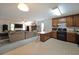 Open concept living room and kitchen featuring a stone fireplace and comfortable seating at 3743 Wyntuck Nw Cir, Kennesaw, GA 30152
