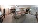 Open-concept living room boasting a stone fireplace, plush seating, and a seamless transition to the adjacent kitchen at 3743 Wyntuck Nw Cir, Kennesaw, GA 30152