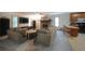 Living room combines a comfortable sitting area, stone fireplace, and adjacent kitchen, offering a cozy and functional layout at 3743 Wyntuck Nw Cir, Kennesaw, GA 30152