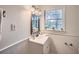 This well-lit bathroom features wainscoting and a classic vanity at 4089 Menlo Dr, Tucker, GA 30084