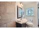 Bathroom features tiled shower, vanity and updated fixtures at 4089 Menlo Dr, Tucker, GA 30084