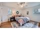 Cozy bedroom with ceiling fan, area rug and ensuite bathroom at 4089 Menlo Dr, Tucker, GA 30084