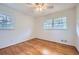 Bedroom with hardwood floors and ceiling fan at 4089 Menlo Dr, Tucker, GA 30084