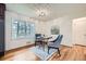 Dining area with a stylish table, comfortable chairs, and plenty of natural light from the window at 4089 Menlo Dr, Tucker, GA 30084