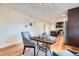 Cozy dining area adjacent to the kitchen, featuring a modern table, chairs, and hardwood floors at 4089 Menlo Dr, Tucker, GA 30084