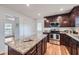 Updated kitchen features granite counters, wood cabinets and stainless steel appliances at 4089 Menlo Dr, Tucker, GA 30084