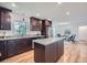 Updated kitchen features granite counters, wood cabinets and stainless steel appliances at 4089 Menlo Dr, Tucker, GA 30084