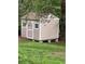 Backyard shed with neutral siding and crisp white trim at 4089 Menlo Dr, Tucker, GA 30084