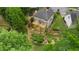 Aerial view showcasing the multiple decks, terraced landscaping, and outdoor living spaces at 4987 Day Lily Nw Way, Acworth, GA 30102