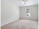 Bright bedroom featuring neutral walls, plush carpeting, and a window providing natural light at 4987 Day Lily Nw Way, Acworth, GA 30102