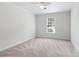 Bedroom with neutral carpet, a ceiling fan, and a window for natural light at 4987 Day Lily Nw Way, Acworth, GA 30102