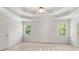 A bedroom with tray ceilings and two windows at 4987 Day Lily Nw Way, Acworth, GA 30102