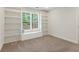 Cozy bedroom featuring built-in shelving and a bright window at 4987 Day Lily Nw Way, Acworth, GA 30102