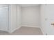 Bedroom with fresh, neutral walls and carpet, next to doorway at 4987 Day Lily Nw Way, Acworth, GA 30102