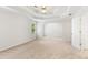 Large bedroom with neutral carpeting and a view into the ensuite bathroom at 4987 Day Lily Nw Way, Acworth, GA 30102