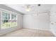 Light and bright bedroom with neutral walls, carpet, and trim at 4987 Day Lily Nw Way, Acworth, GA 30102