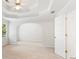 A bedroom with tray ceilings that is empty and has an archway at 4987 Day Lily Nw Way, Acworth, GA 30102